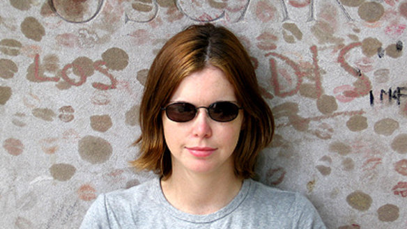 Writer Angelique Flowers, who died from cancer last month, at Oscar Wilde's grave at Pere Lachaise cemetery in Paris in 2006.