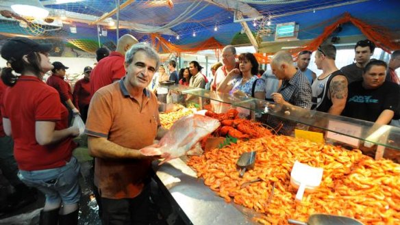 Managing director John Fragopoulos with some of his fish, prawns and lobster  for sale at FishCo-Downunder at  Belconnen Fresh Food Markets.