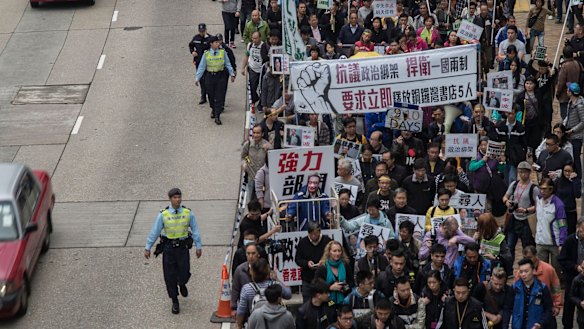 People take part in a rally on January 10 in Hong Kong, protesting the disappearance of five Hong Kong booksellers.