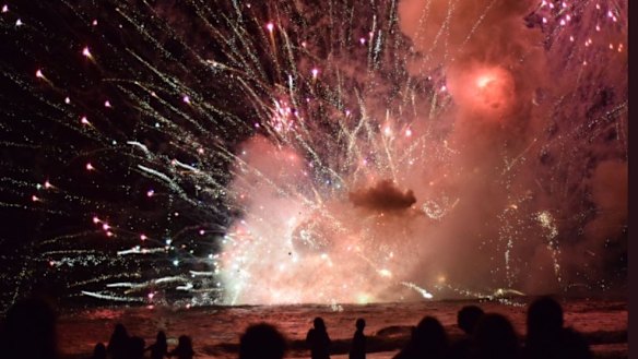 Crowds were evacuated from Terrigal Beach on the Central Coast after a barge carrying fireworks caught alight during the 9pm show.