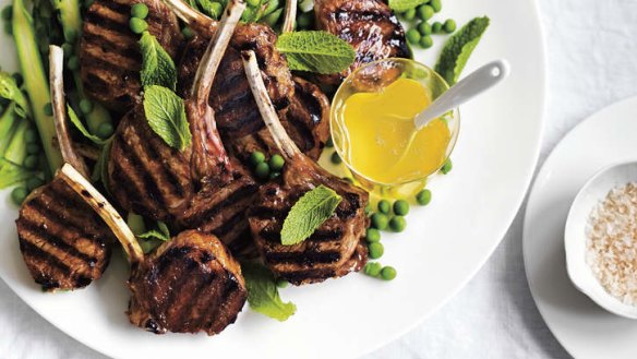 Barbecued lamb cutlets with mint sauce.