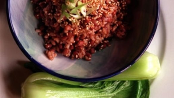 Red rice with spring onions and toasted sesame seeds