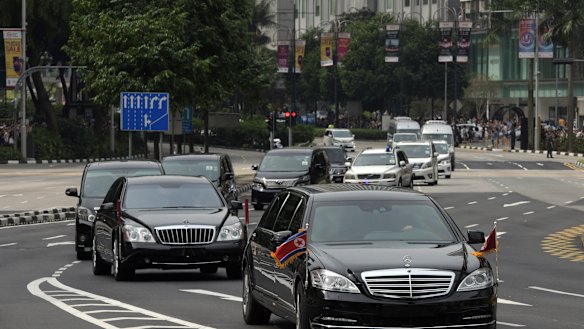 The North Korean motorcade, believed to be carrying North Korean leader Kim Jong-un, travels along Singapore's Orchard Road on Sunday, ahead of the summit with US leader Donald Trump..