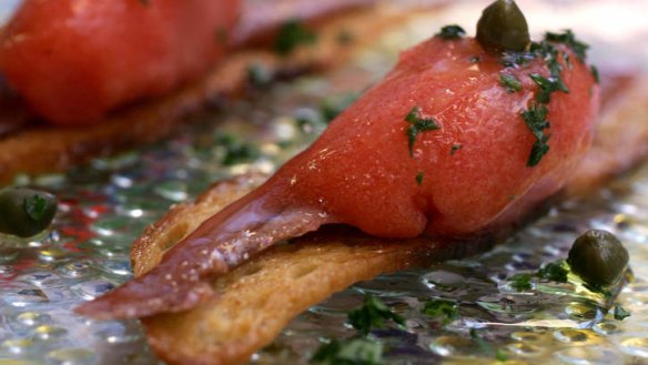 Go-to dish at Movida: anchovy, layered on a square of toast with smoked tomato sorbet.