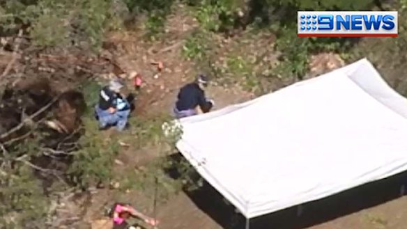 Detectives interview three people after body found in shallow grave