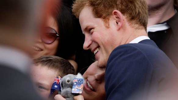 Prince Harry greets fans during his visit to Sydney in 2013.