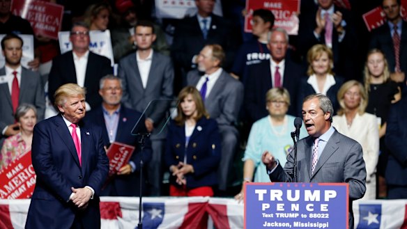 Nigel Farage, ex-leader of the British UKIP party, speaks as Republican presidential candidate Donald Trump, left, listens, at Trump's campaign rally in Jackson, Mississippi in 2016.