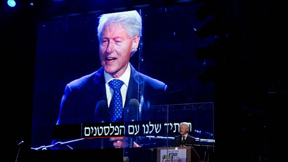 Former US President Bill Clinton speaks during a rally marking 20 years since the assassination of the late Israeli Prime Minister Yitzhak Rabin.
