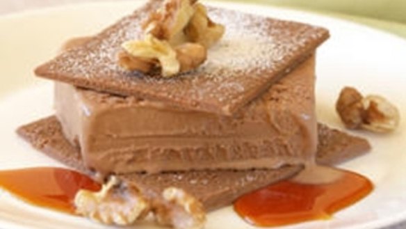 Chocolate ice-cream sandwiches with walnuts and orange syrup