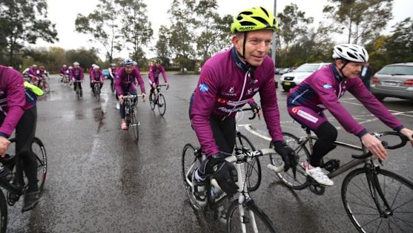 Prime Minister Tony Abbott arrives in Penrith after completing a charity bicycle ride.