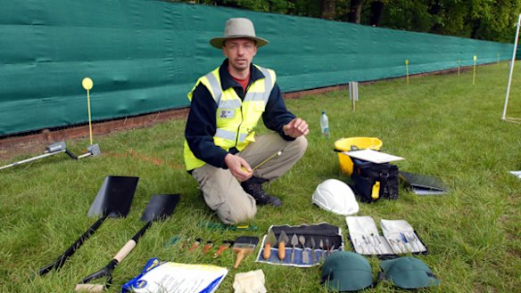 Tools are laid out to start the exhumation.