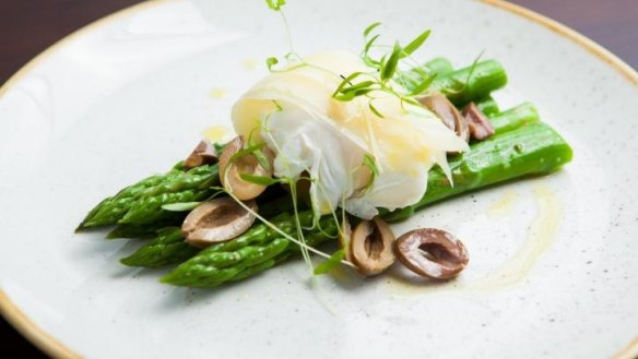 Entree of asparagus, egg, olive and comte cheese.