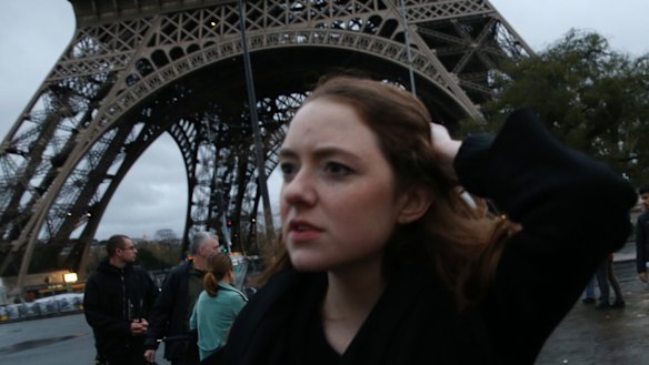 Tourists flee as Police clear the Eiffel Tower.