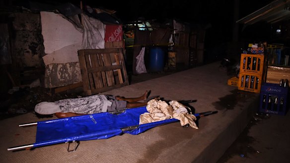 The body of Rolito Nunez lays on a footpath in Quezon City after he and another man were executed by six unidentified men on motorbikes on April 18. 