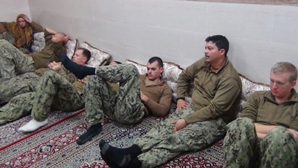 This picture released by the Iranian Revolutionary Guards shows the detained US Navy sailors at an undisclosed location.