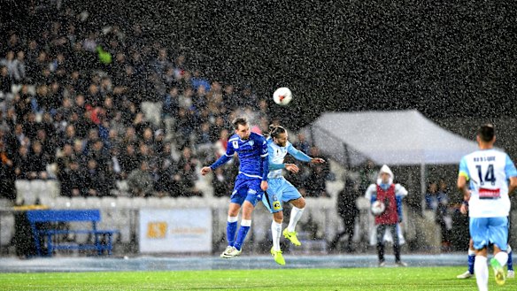Cross-division: Milos Lujic of South Melbourne and Joshua Brillante of Sydney FC in the FFA Cup semi-final. Teams from the NPL would be invited to be part of The Championship with the eventual hope of having promotion and relegation with the A-League.