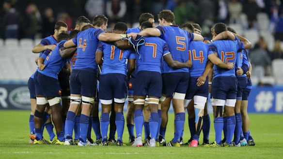 Debrief: France players gather after their win over Romania. 