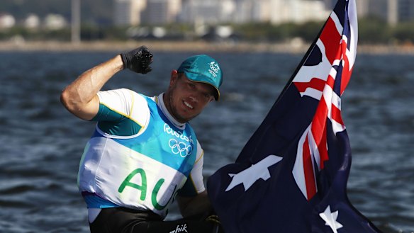 Tom Burton with an Australian flag after the win.