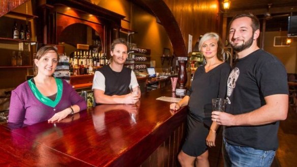 Kym Wojcik, Callum Copeland-Fleet, Lisa Portolan and Joel Baines enjoy a drink in their newly-acquired pub, Pot Belly, Belconnen. 