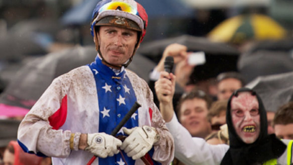 Jockey Gerrald Mosse returns to scale on Americain after his Melbourne Cup win.