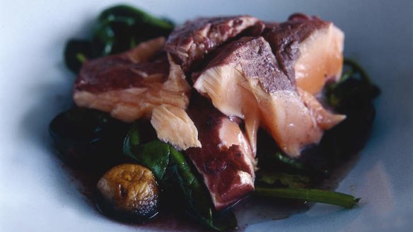 Salmon poached in red wine with mushrooms and spinach