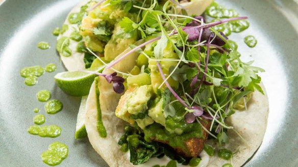 Pork belly tortillas are marinated with orange and star anise.