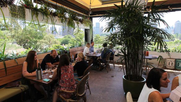 Tropical air: The terrace has great views of the Domain and city skyline.