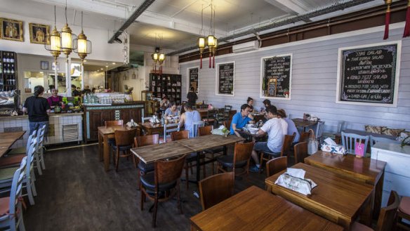 The massive warehouse dining room features elegant lanterns.