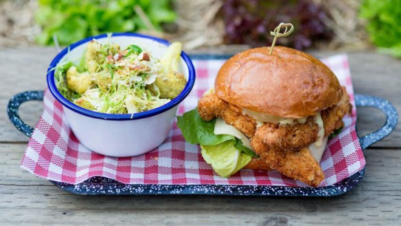 Buttermilk chicken burger with a side of roasted cauliflower.