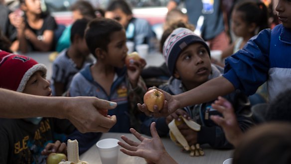 Children wait for breakfast at a migrant shelter in Tijuana, Mexico, on April 28. 