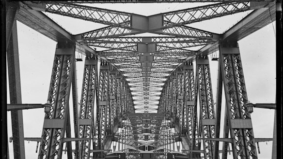 The road and underside of the arch of Sydney Harbour Bridge, from about 1932.