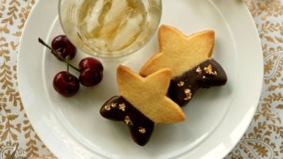 Chocolate amaretto sandwich biscuits with fresh cherries