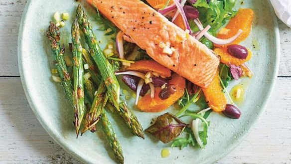 Grilled salmon salad with orange and asparagus.