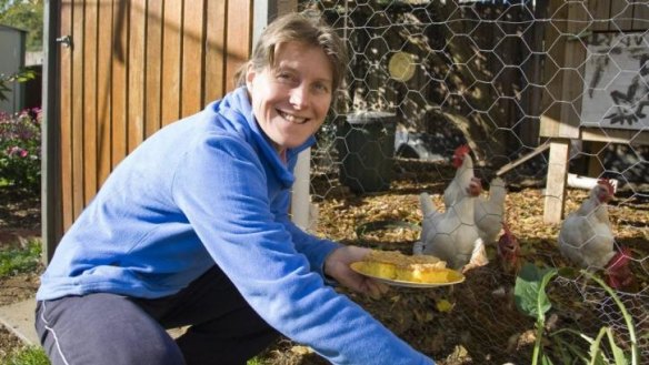 Pia Asa, of Downer, with her chooks in their coop.