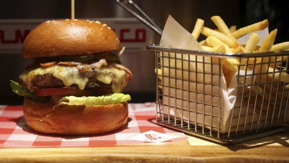 Brooklyn burger with bacon, smoked cheddar, tomato, pickles, onion and lettuce with thousand island dressing.