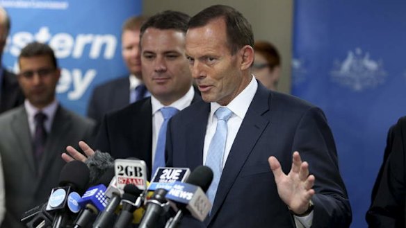 Tony Abbott tries to talk about infrastructure instead of Barry O'Farrell at Liverpool Council on Wednesday.