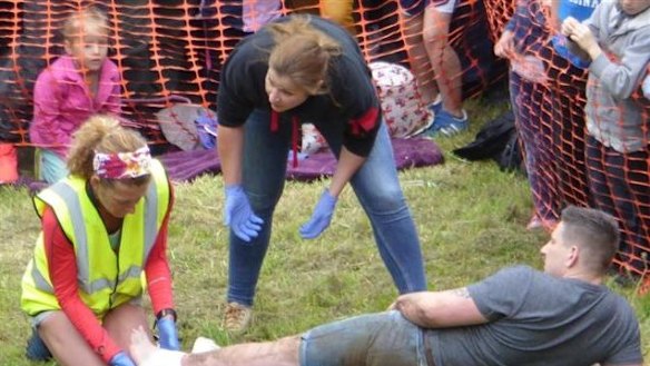An injured cheese-roller gets treatment.