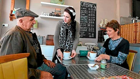 Hot gossip: Sian Clayton serves John and Lynne Hollis.