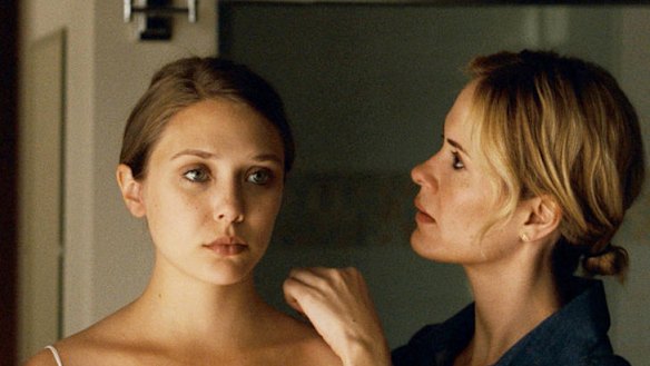 Elizabeth Olsen (left) as the troubled title character and Sarah Paulson in <i>Martha Marcy May Marlene</i>.