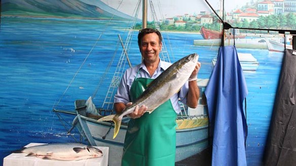 King of the seas ... Greg Imisides from Claudio's Quality Seafoods brandishes a kingfish.