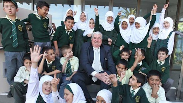 Dr Ray Barrett with students at the Malek Fahd School in Greenacre.