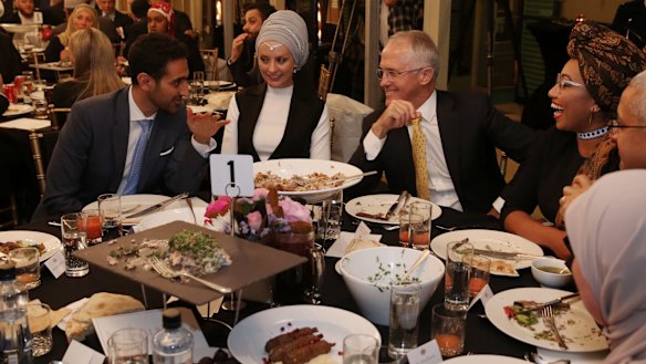 Waleed Aly (left) with his wife, Susan Carland (second left) attend Prime Minister Malcolm Turnbull's 2016 Iftar dinner.