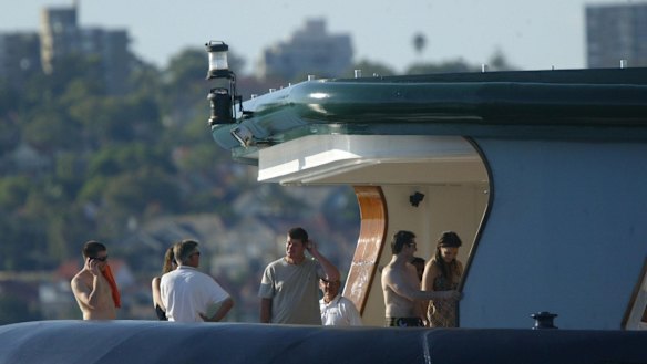 Old friends: James Packer in 2005 aboard Arctic P with Tom Cruise and Katie Holmes (right) and Tommy Davis (shirtless, far left).