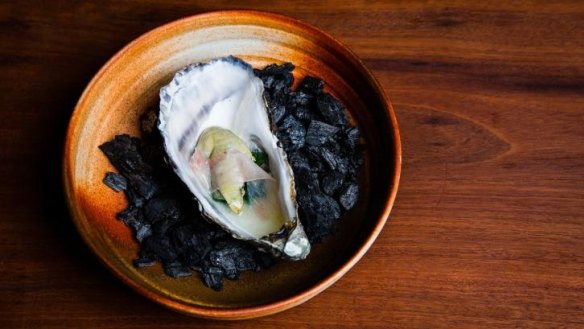 Primal element: Oyster with seaweed and guanciale served on coals.