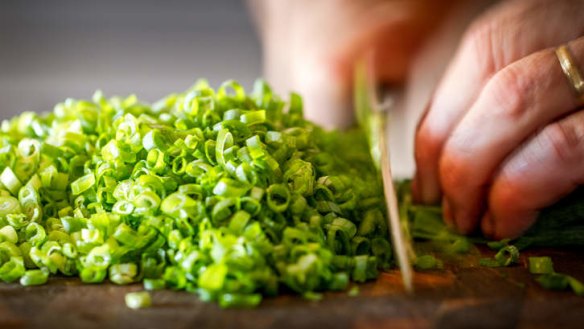 Preparing noodles using spring onions and ginger - once you've tried them, you'll never go back to the two minute ones.