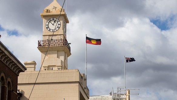 Flags flying over Richmond Town Hall, where Yarra Council took its controversial vote. 