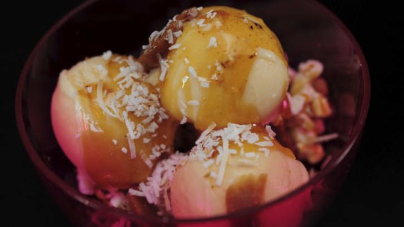 Ice-cream sundae with coconut, popcorn and palm sugar caramel.