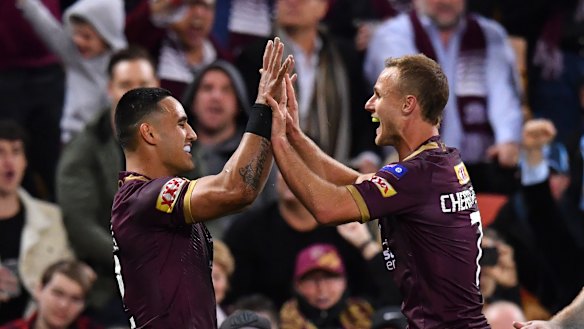 Reason to smile: Daly Cherry-Evans (right) was booed by some at the start but the crowd changed its tune.