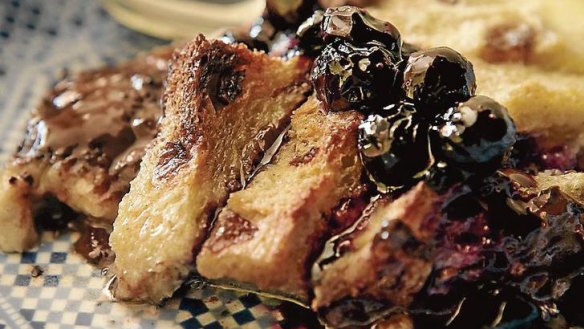 Chocolate bread and butter pudding with blueberry sauce.