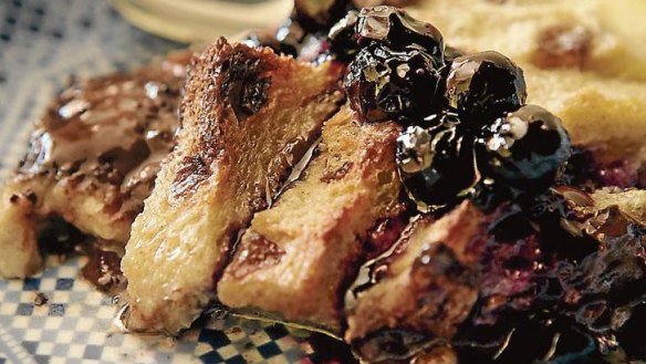 Chocolate bread and butter pudding with blueberry sauce.